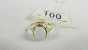 A 9ct yellow gold oval opal ring, size O.