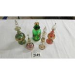 5 coloured glass scent bottles.