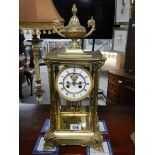 A good brass chiming mantel clock complete with mercury pendulum and in working order.