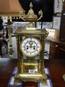 A good brass chiming mantel clock complete with mercury pendulum and in working order.