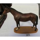 A large brown Beswick horse, in good condition.
