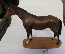 A large brown Beswick horse, in good condition.