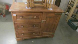 A rustic style one door, three door cupboard.