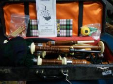A cased set of bagpipes.