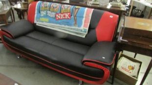 A black and red retro settee.