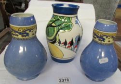 A Wedgwood Clarice Cliff 'Bizarre' vase and a pair of Turin contemporary vases.