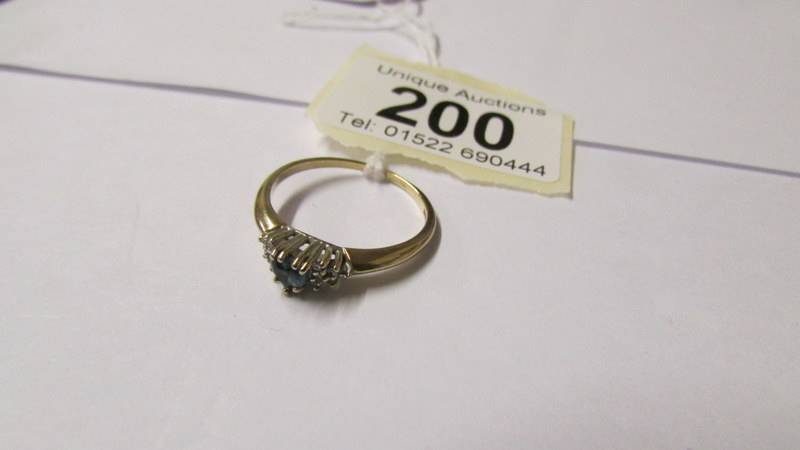 A 9ct gold diamond and topaz dress ring, size T. - Image 2 of 3