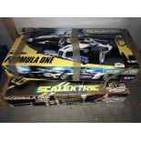 2 Scalextric Formula 1 sets, Silverstone set missing one car, other set missing both cars.