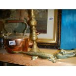 An oval copper kettle, a brass candlestick and a brass crocodile.