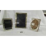 3 silver photo frames with easel stands, 15 x 11 cm, 10 x 7.5 cm and 10.5 cm x 7.5 cm.