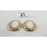 A pair of 9ct gold earrings, 4 grams.