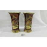 A pair of beautiful 15 cm tall hand enamelled and painted Carlton ware vases with markings to base.