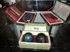 2 collectable boxed oriental artist sets & a boxed cloissonne stress balls