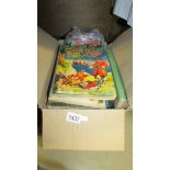 A box containing various children's books including worn but early Rupert.