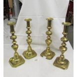 2 pairs of tall Victorian brass candlesticks.