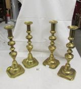 2 pairs of tall Victorian brass candlesticks.