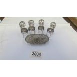 A miniature filigree table and 4 chairs (possibly silver), 2 chairs a/f.