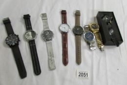 8 Gent's quartz wrist watches all in working order.