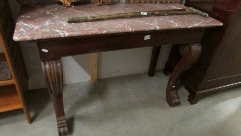 A marble topped console table. ****Condition report**** Width 124cm. Depth 52cm.