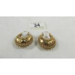 A pair of 9ct gold earrings, 7 grams.