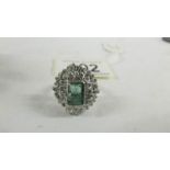 A 14ct white gold 1.75 emerald and 1.8 diamonds ring, size P.