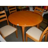 A circular table and 4 chairs.