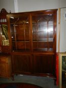 A mahogany astragal glazed bookcase.