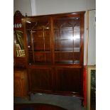 A mahogany astragal glazed bookcase.