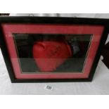 A cased signed boxing glove, Sir Henry Cooper.