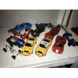 A quantity of used Scalextric cars in various conditions.