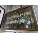 A display cabinet of miniature spirits.