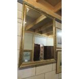 A bevel edged gilt framed mirror, 87 x 110 cm.