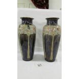 A pair of 25 cm Royal Doulton vases signed Eliza Simmons.