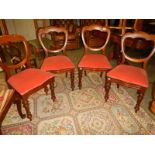 A set of 4 mahogany dining chairs.