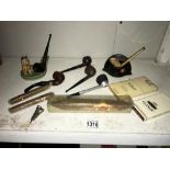 A quantity of vintage pipes etc., including Wade stand, cigars etc.