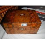 A Victorian inlaid sewing box.