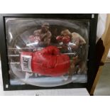 A framed signed boxing glove 'Frank Bruno' with certificate of authentication.