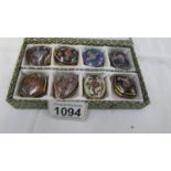 A boxed set of 8 Chinese Cloissonne enamel pill boxes.