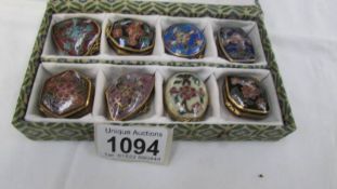 A boxed set of 8 Chinese Cloissonne enamel pill boxes.