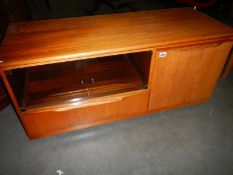 A teak television stand.