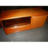 A teak television stand.