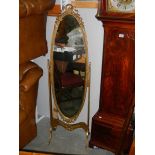 A Regency style cheval mirror.