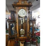 An Unusual Victorian mahogany Vienna wall clock with side mirrors and shelves, in working order.