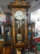 An Unusual Victorian mahogany Vienna wall clock with side mirrors and shelves, in working order.