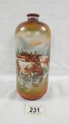 A Victorian hand painted vase depicting 5 cows in water with a background of mountains,