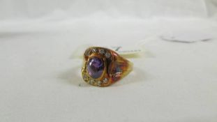 An 18ct gold ring set amethyst coloured stone, size T.
