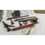 A mixed lot of tribal items including ceremonial axes, knives etc.