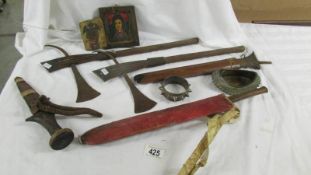 A mixed lot of tribal items including ceremonial axes, knives etc.