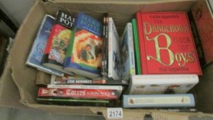 A box of children's books including Harry Potter.