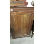 A mahogany cupboard.